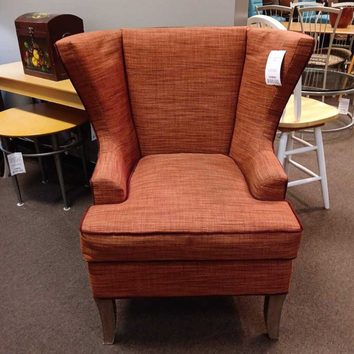 Rust Wing Back Chair.